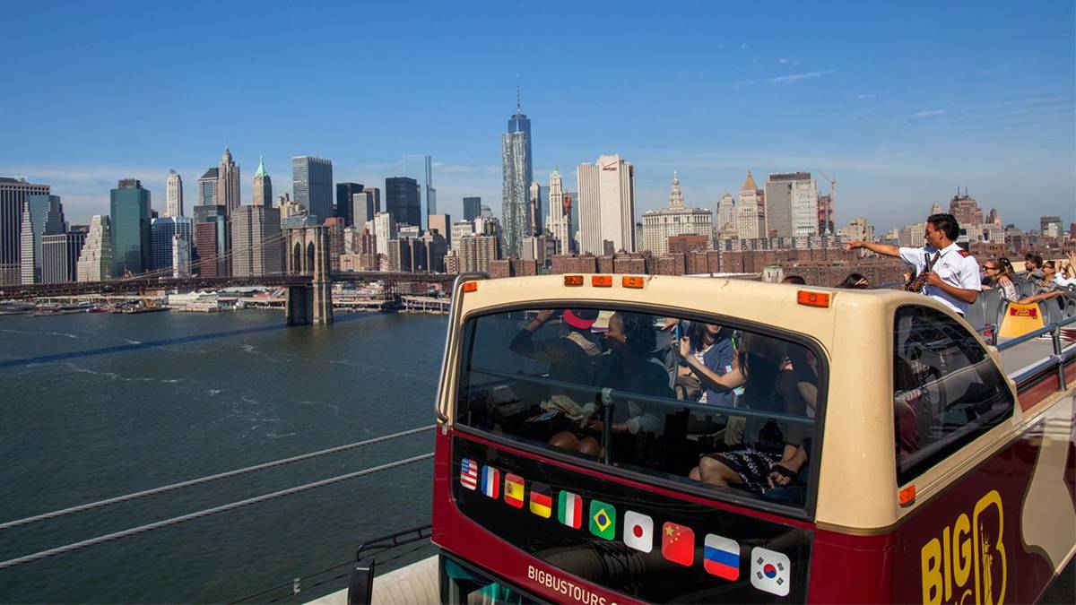 tourists taking a Big Bus Tour in New York City, New York, USA